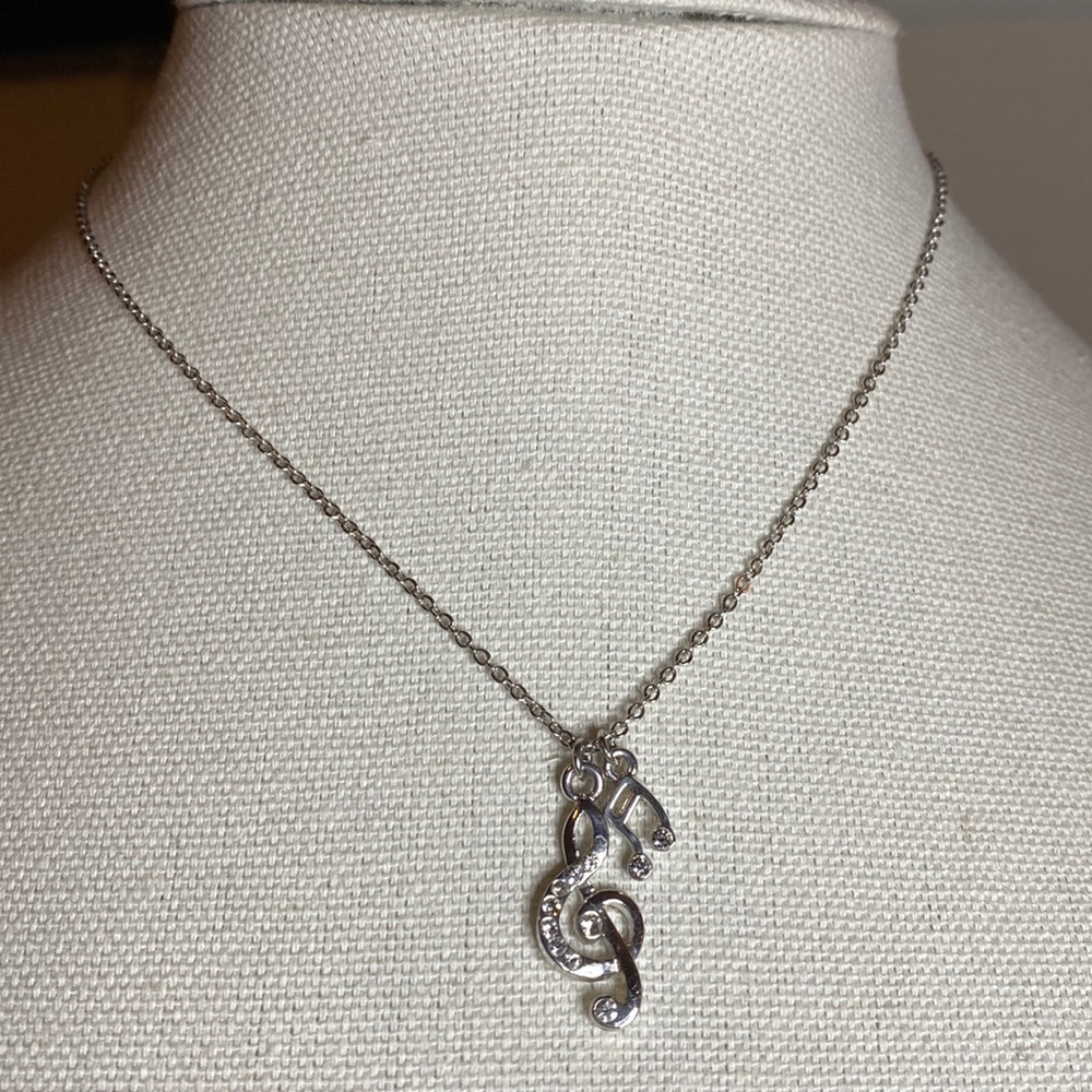 Silvertone Musical notes G clef necklace with rhinestones